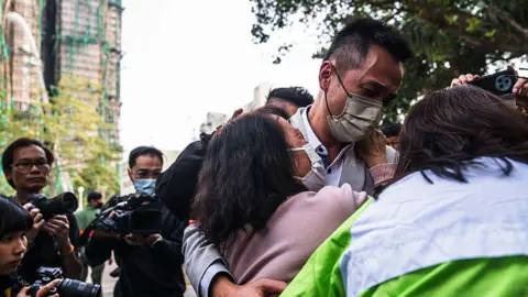 Tragedy in Hong Kong: Families Await News After Deadly High-Rise Blaze