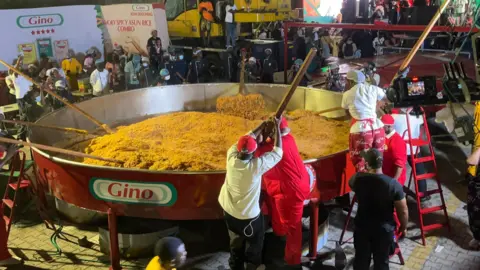 Nigerian Chef Aims to Set Record with Giant Pot of Jollof Rice
