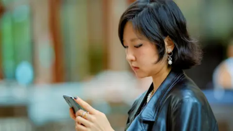 The Rise of 'Are You Dead?': A Mobile App Addressing Solitude in China's Urban Areas