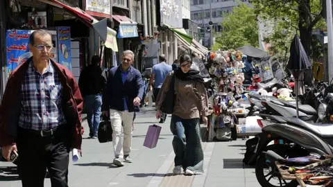 Resilience Amidst Crisis: Daily Life in Tehran as War Looms