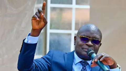 Uganda's Electoral Chief Faces Threats Over Presidential Results Declaration