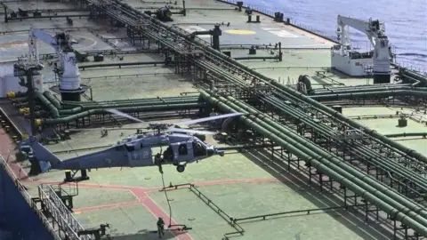 US Navy Boards Vessel Carrying Iranian Oil Amid Escalating Tensions