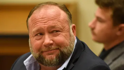The Onion Proposes Parody Takeover of Infowars Amidst Legal Turmoil
