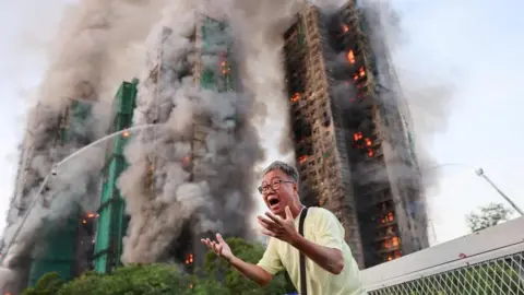 Tragedy Strikes Hong Kong: Fire Claims Lives and Engulfs Tower Blocks