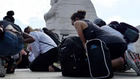 Fired Agents Claim Retribution Over Racial Justice Protest Gesture